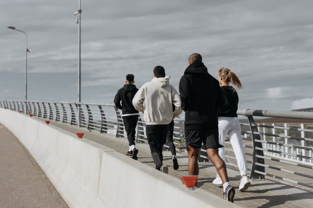 back view of a people running together